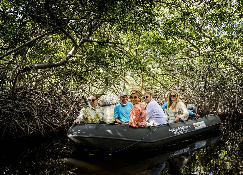 King Willem-Alexander, Queen Máxima and the Princess of Orange tour the mangroves in Bonaire by boat
