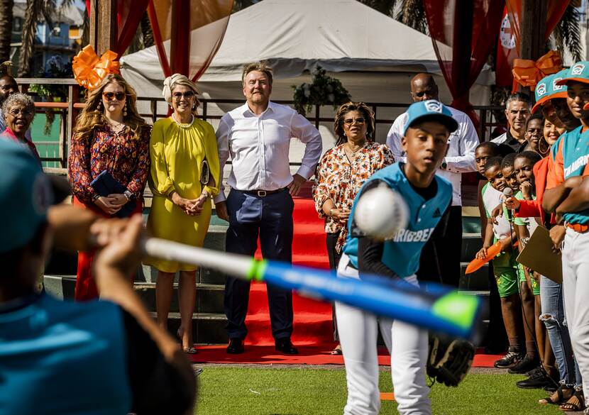 King Willem-Alexander, Queen Máxima and the Princess of Orange watch children taking part in sports contests in Curacao