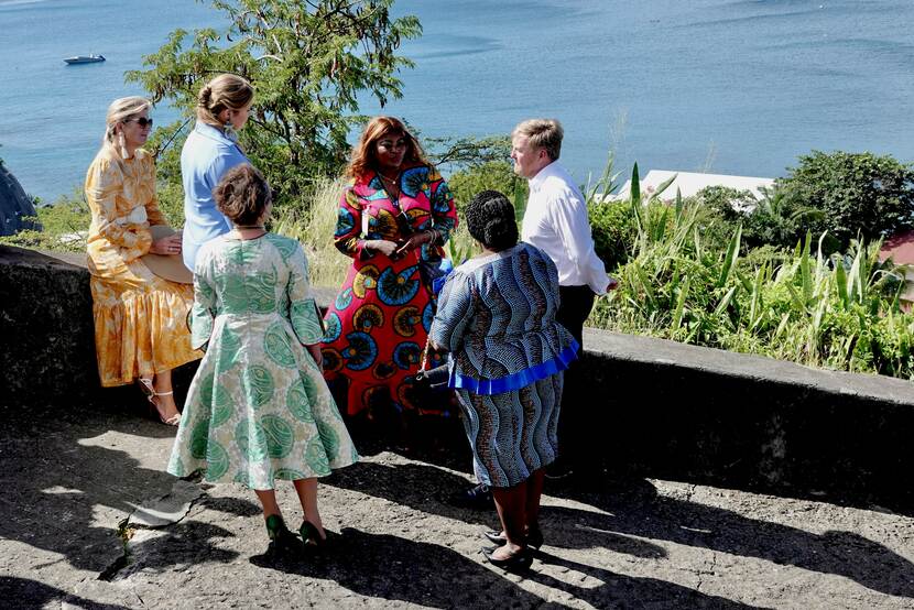 King Willem-Alexander, Queen Máxima and the Princess of Orange walk through Oranjestad’s historical centre in St Eustatius