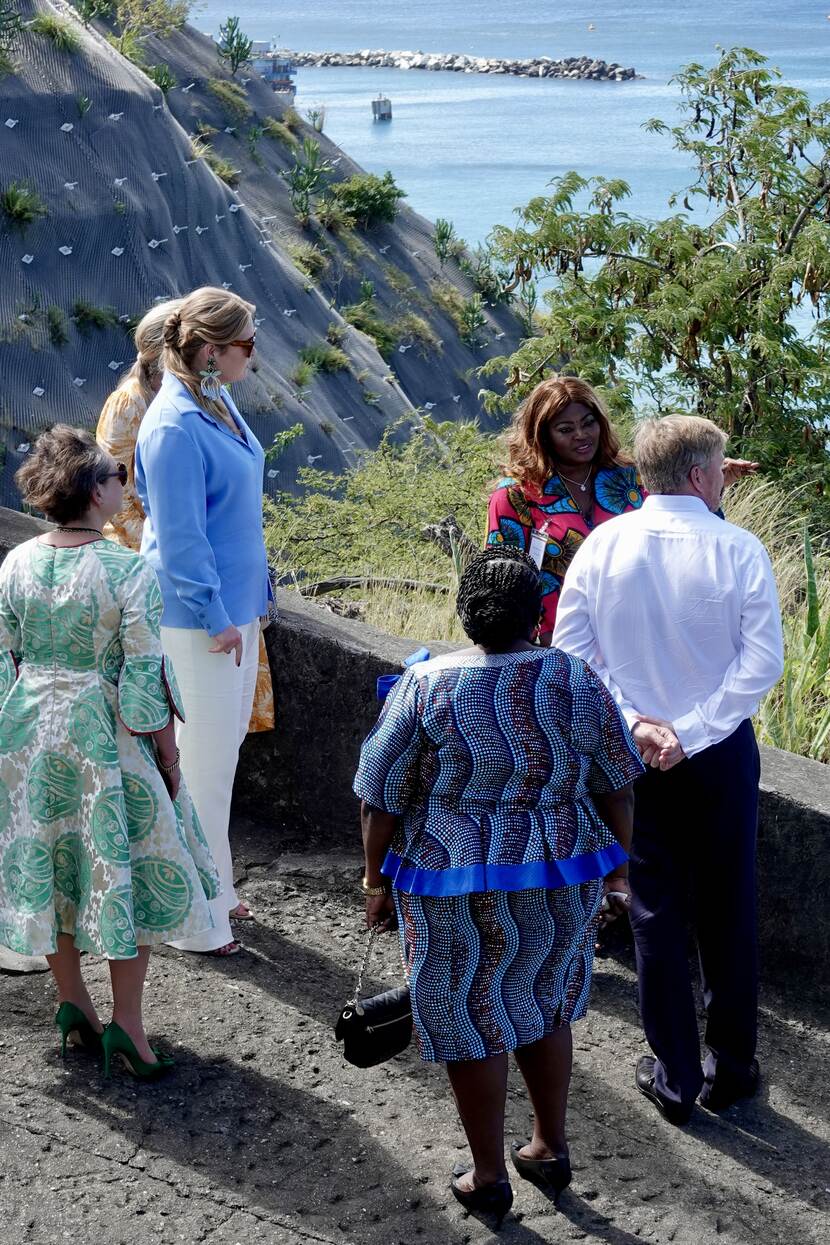 King Willem-Alexander, Queen Máxima and the Princess of Orange walk through Oranjestad’s historical centre in St Eustatius